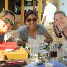 Amanda and friends sitting at a restaurant table.
