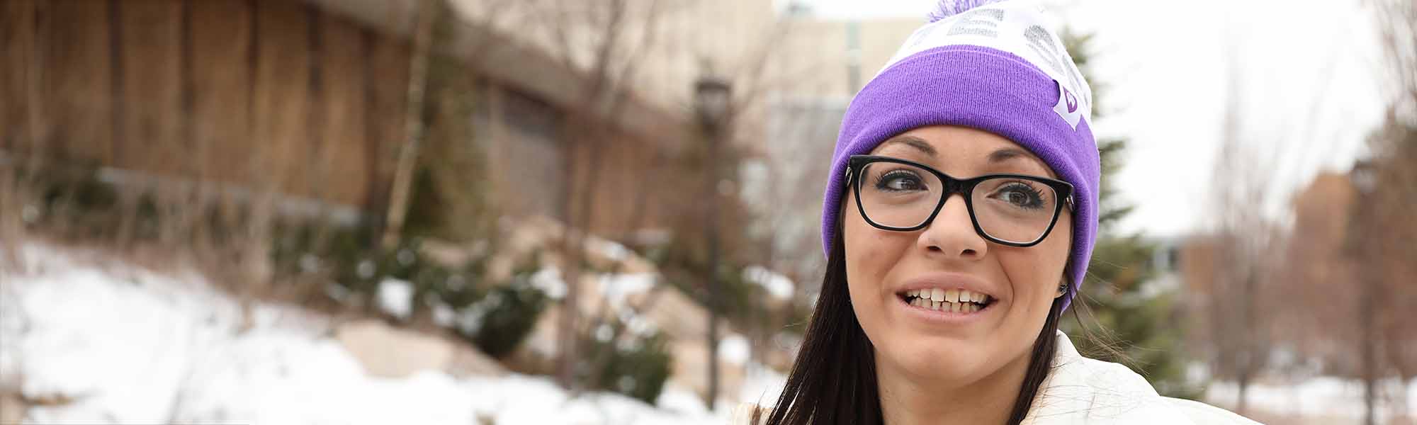 Girl with glasses on Weber State University campus.