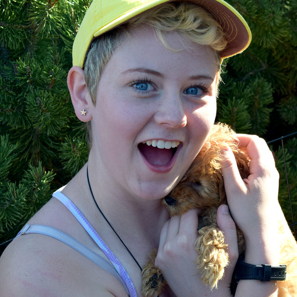 student holding puppy