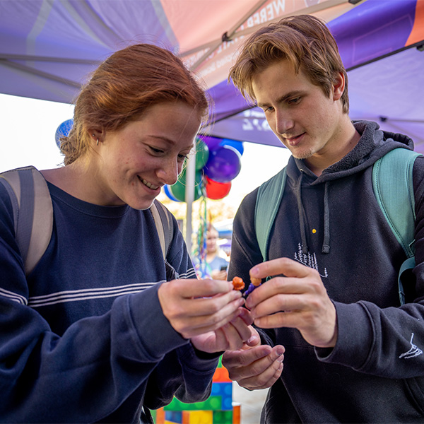 students creating lego figures