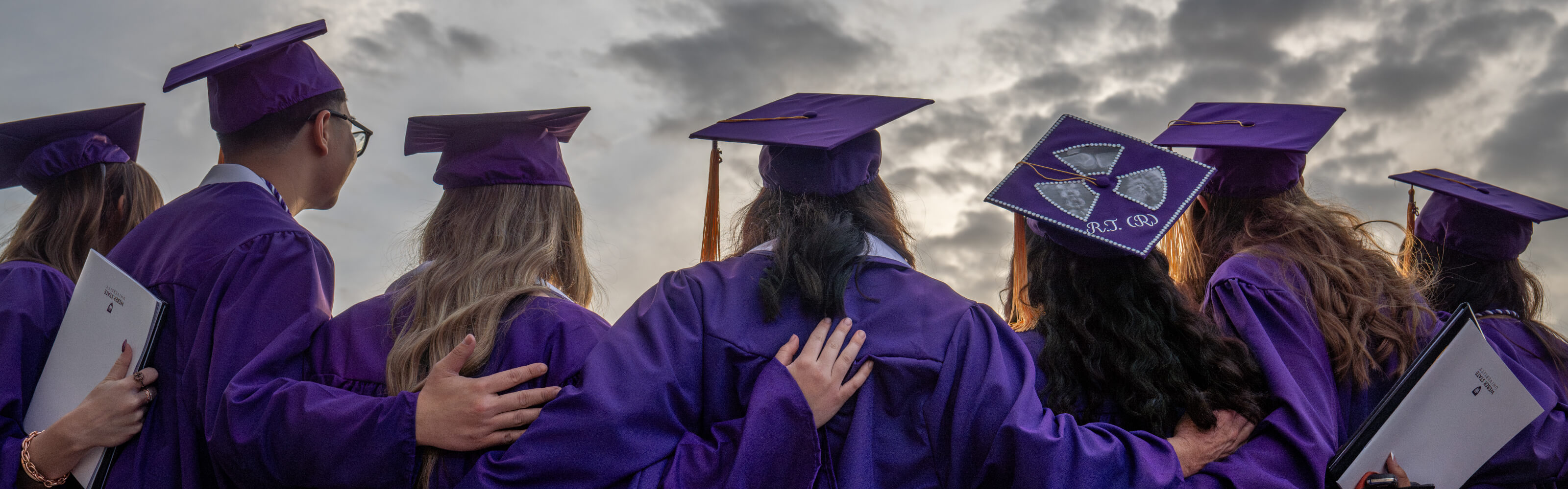 Weber State University graduates in purple caps and gowns