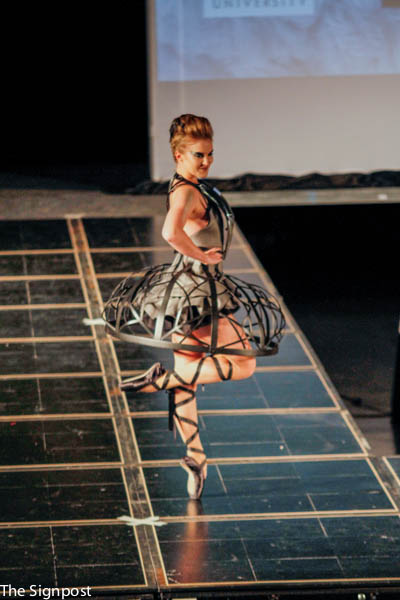 SU interior design team model Ashley Badali walks down the runway during the Fashion Remix competition. The team’s ensemble won runway presence at the event. (Photo by: Lichelle Jenkins)
