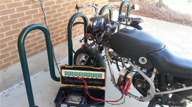 A motorcycle modified with an electric motor gets more juice at a solar charging station at the Weber State University in Ogden. A team of engineering students completed the charging station last spring. Their supervising assistant professor, Fred Chiou, would like to see several more added throughout the campus to encourage sustainable commuting.