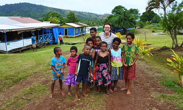 student with kids in fiji