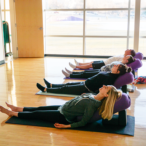 students engaging in therapeutic yoga