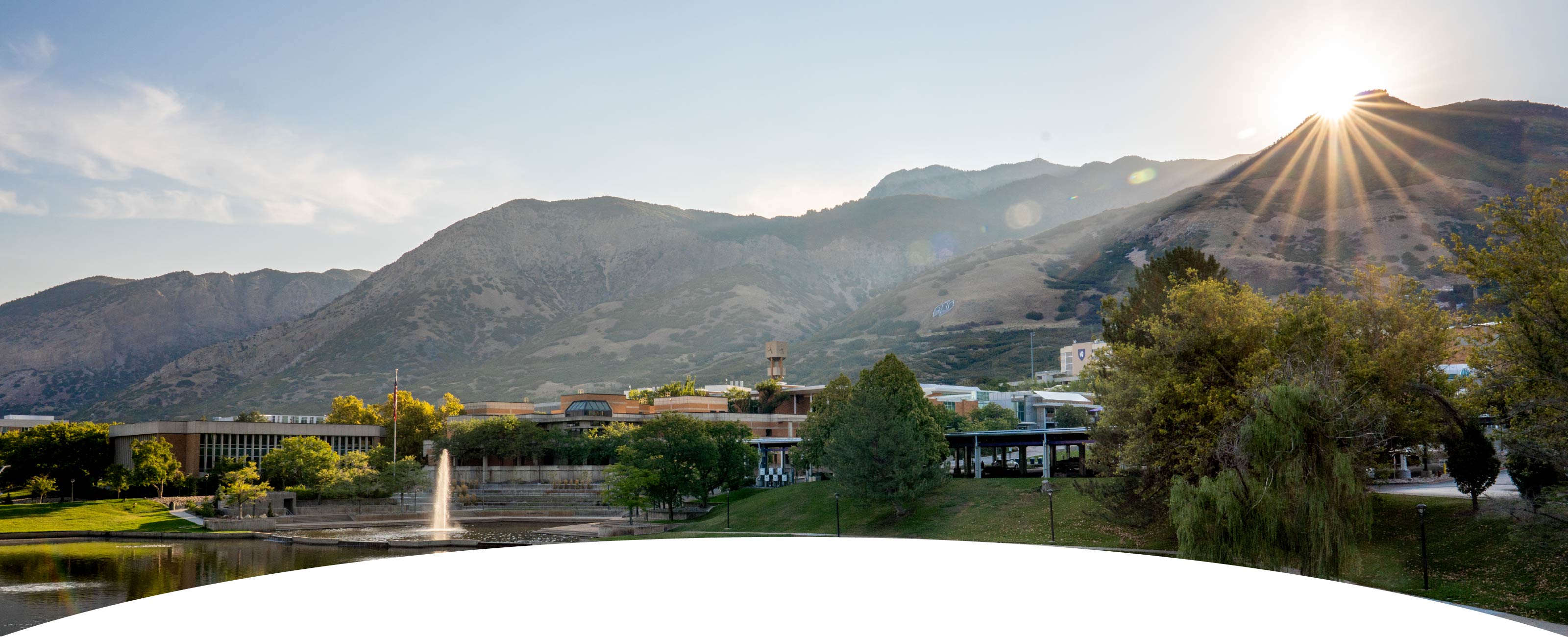 Student and Staff Looking at a Computer