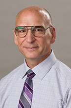 Dr. Mark L .Huson