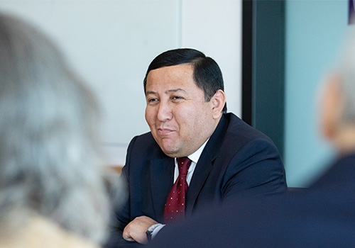 Delegate of Uzbekistan's Ministry of Education intently listening to the educational discussions being had with Weber State Staff & Faculty.