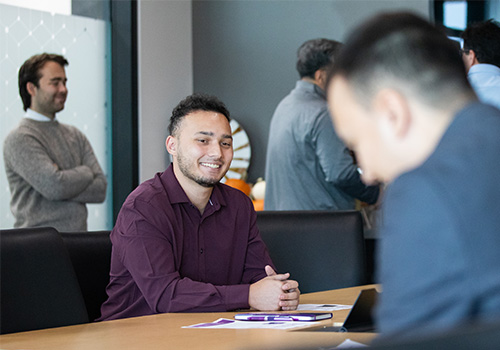 Uzbekistan's Ministry of Education & Weber State University Staff & Faculty engaging in meaningful discussions regarding education.