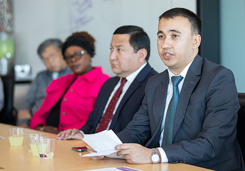 Delegate of Uzbekistan's Ministry of Education discussing educational policy with Weber State Staff & Faculty.