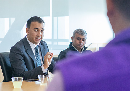 Delegate of Uzbekistan's Ministry of Education discussing educational policy with Weber State Staff & Faculty.