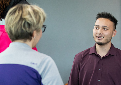 Delegate of Uzbekistan's Ministry of Education discussing educational policy with Weber State Staff & Faculty.