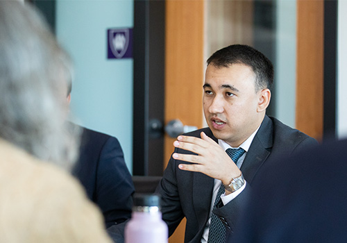 Delegate of Uzbekistan's Ministry of Education discussing educational policy with Weber State Staff & Faculty.