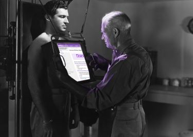 a doctor examining a patient with xray technology