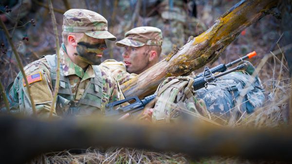 Two male Cadets in the forest during field exercise