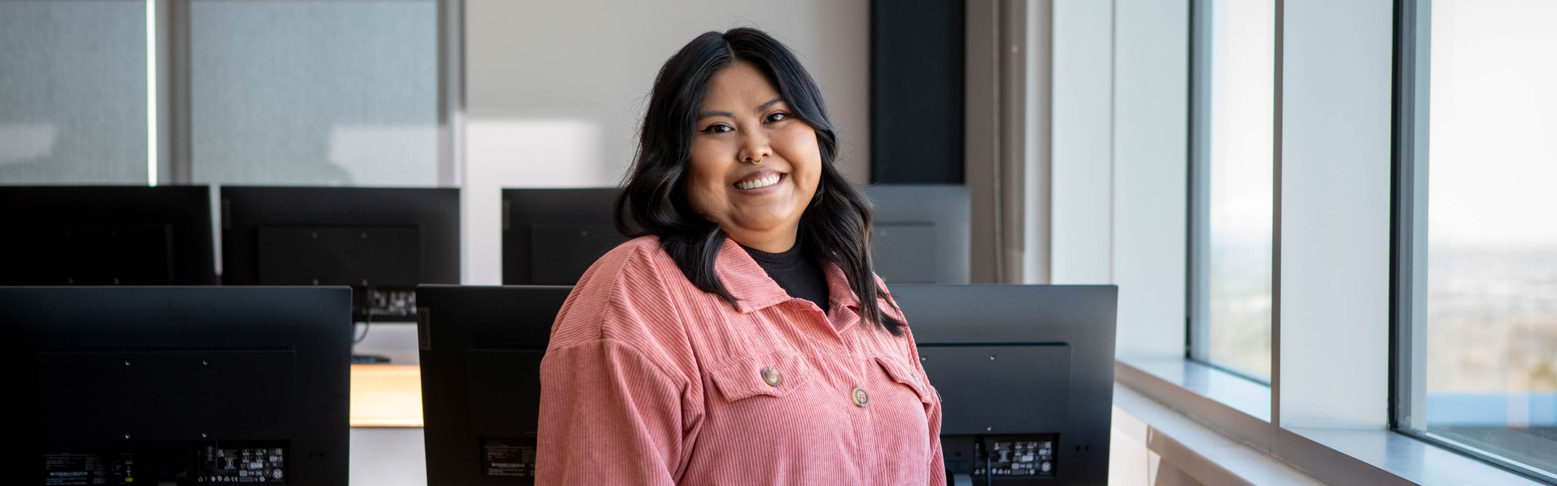 Portrait of Shelby Watchman in a computer lab