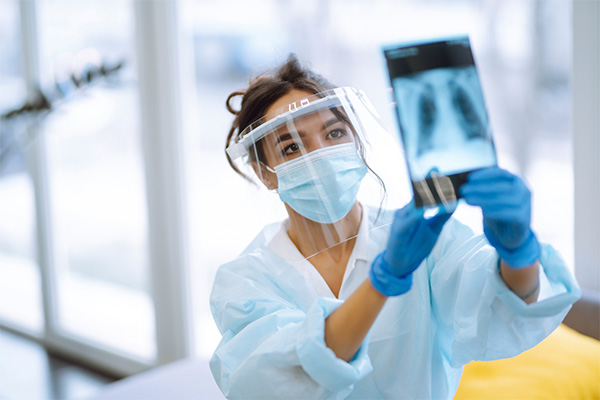woman looking at xray of lungs