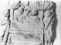 Black and white photograph of a carved stone relief showing the bier of Buddha.