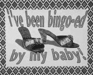 Picture of two spike heeled sandles with the words, "I've been bingo-ed by my baby" a work by Nora Naranjo-Morse.