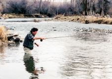 Photo of David James Duncan fly fishing.